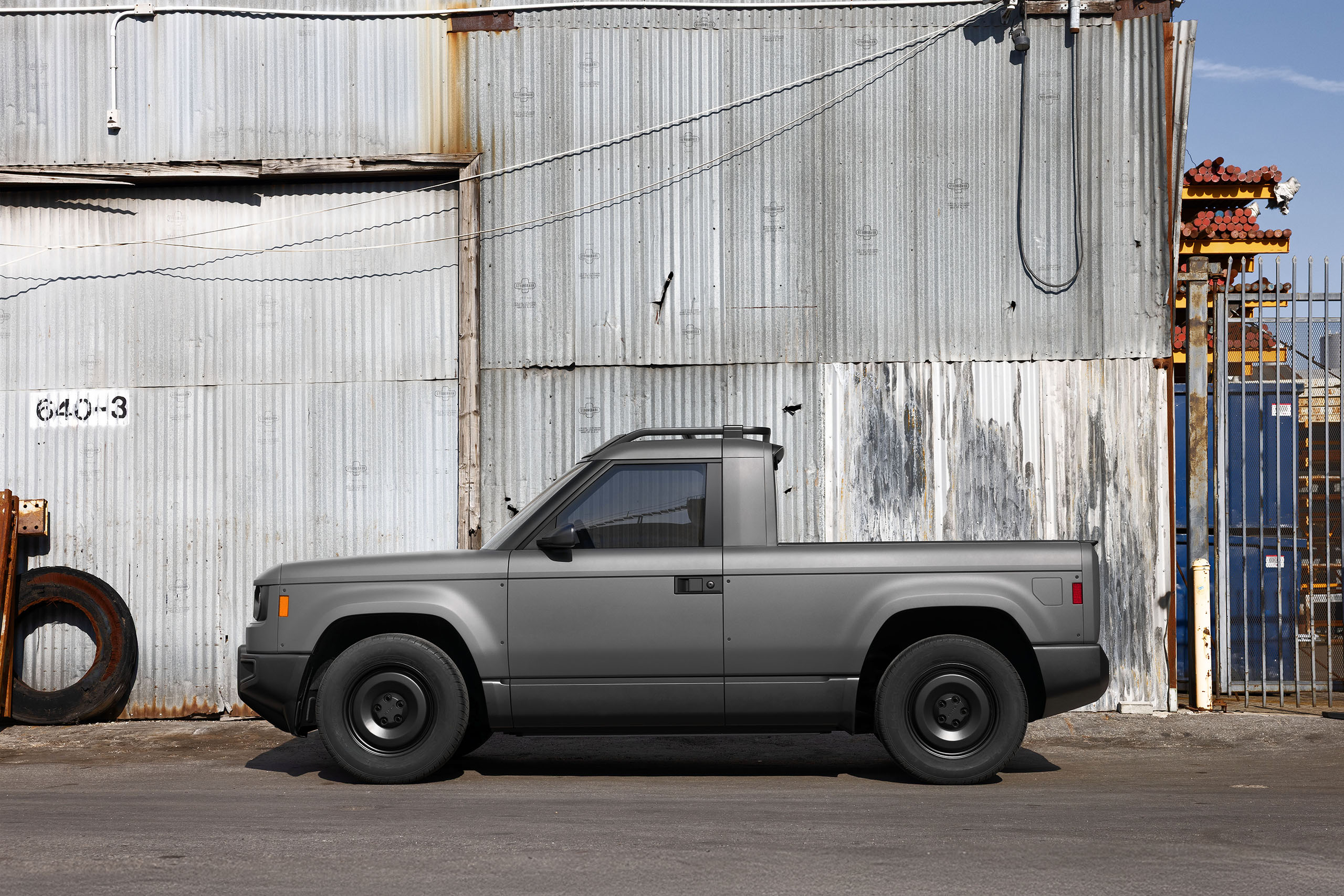 A Slate Auto prototype electric pickup truck in an industrial setting.